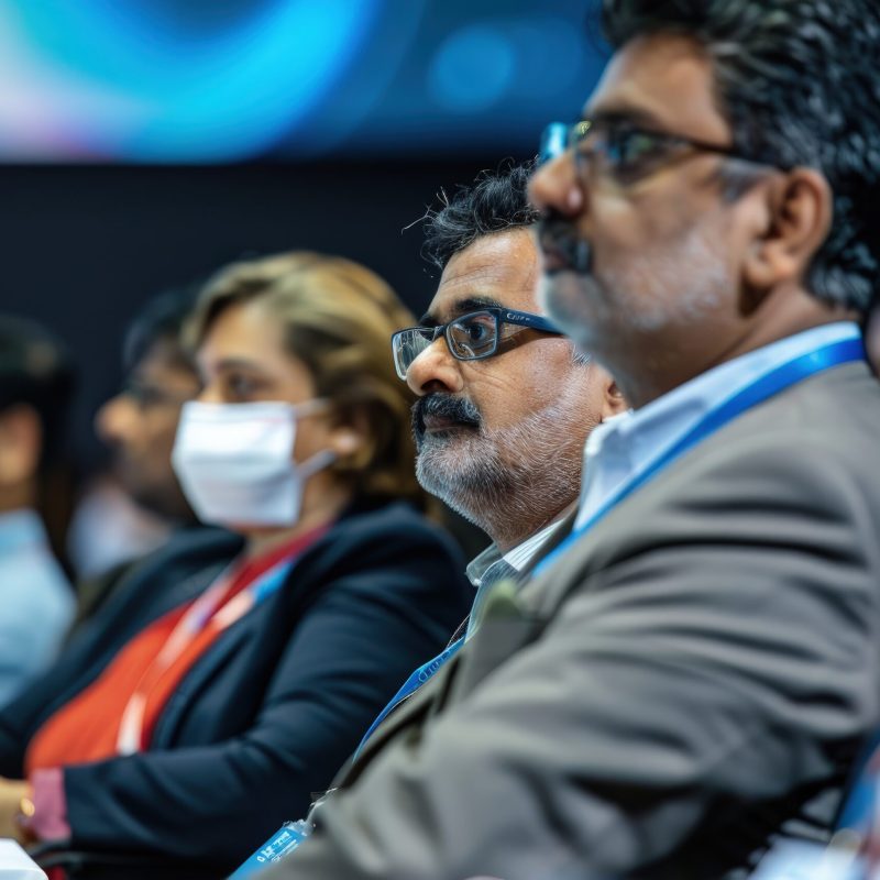 A delegation of Indian professionals attends an international conference, representing their country and exploring global business prospects.
